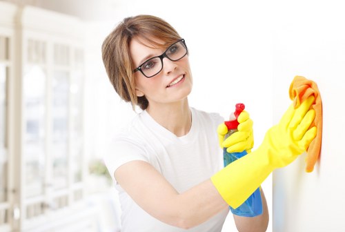 Local cleaner removing dirt from a family sofa in Barnet