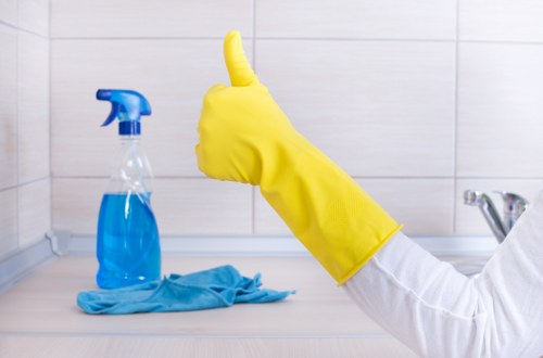 Cleaner treating a hallway carpet in Barnet