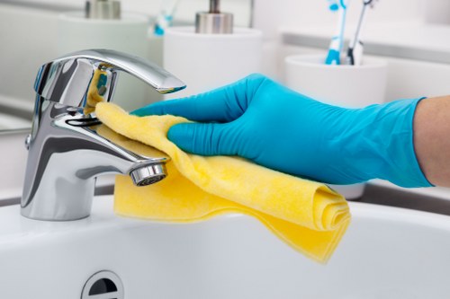 Staff member wearing PPE during a deep cleaning service in Barnet